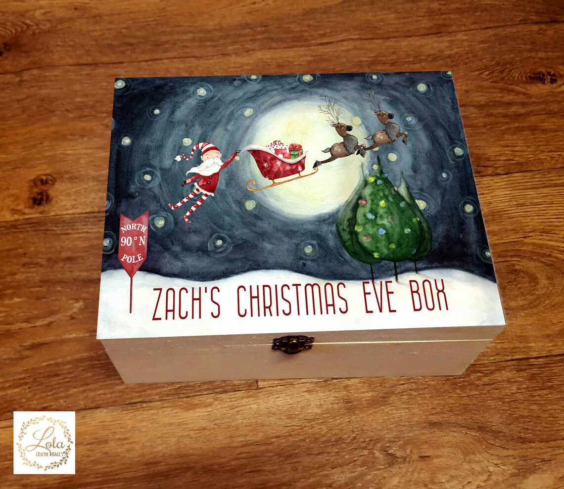 wooden christmas eve box, great for children or families especially first christmas. a luxury box with cute printed santa scene with santa holding on to sleigh