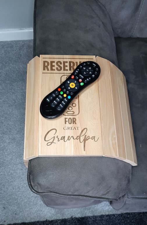 Wooden sofa arm tray with laser engraved personalisation featuring reserved for beer or tea, great gift for him or gift for her with remote control design