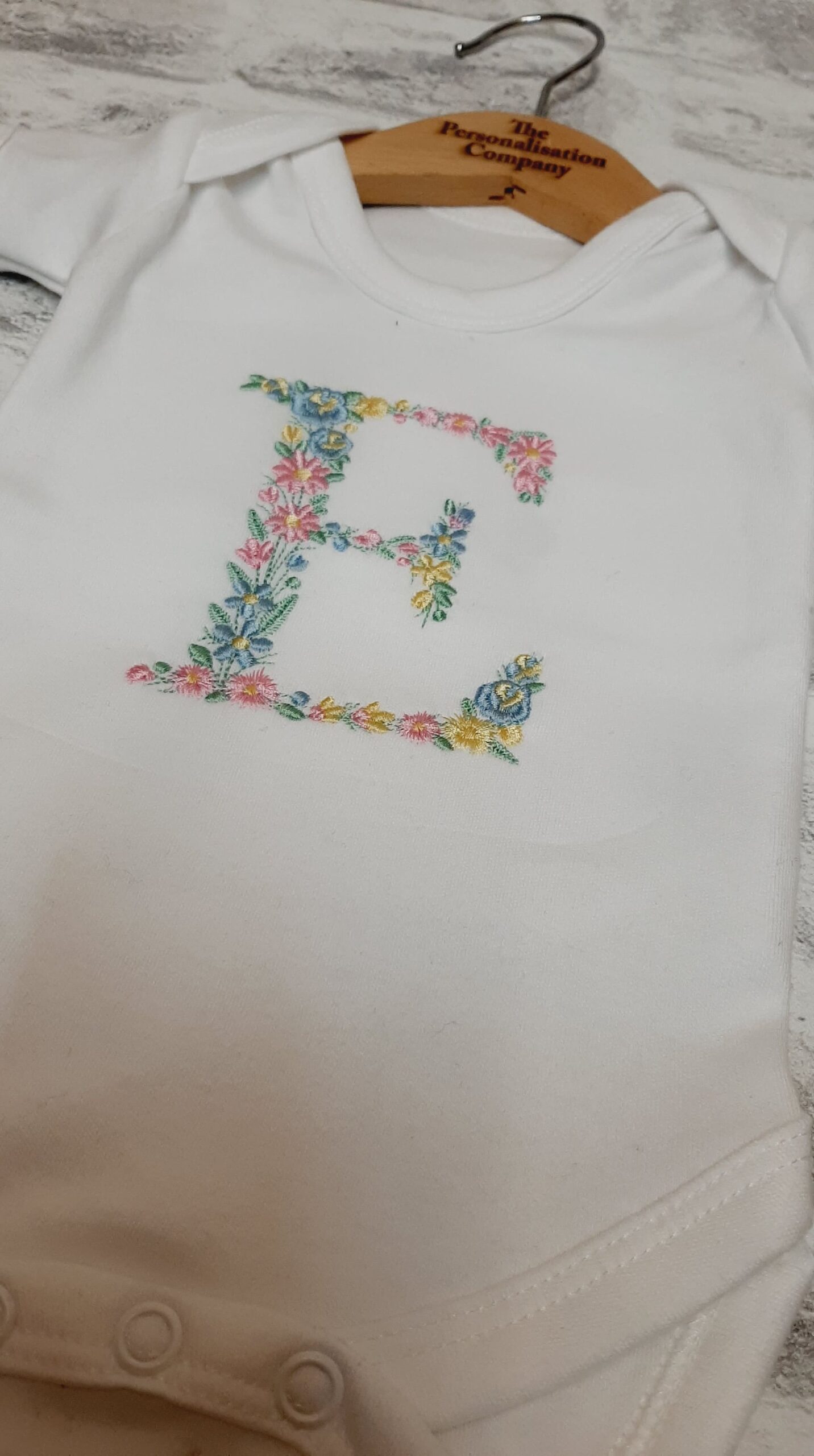 baby vest with floral initial