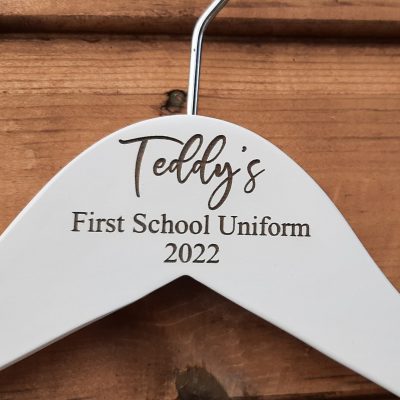 Personalised wooden school uniform hanger. Personalised engraved beer glass. Beautiful engraved personalised gift for every occasion. Personalised gifts for daddy. This image is shown on the personalisation company website. Personalised and affordable gifts for every occassion. Visit www.the-personalisation-company.co.uk