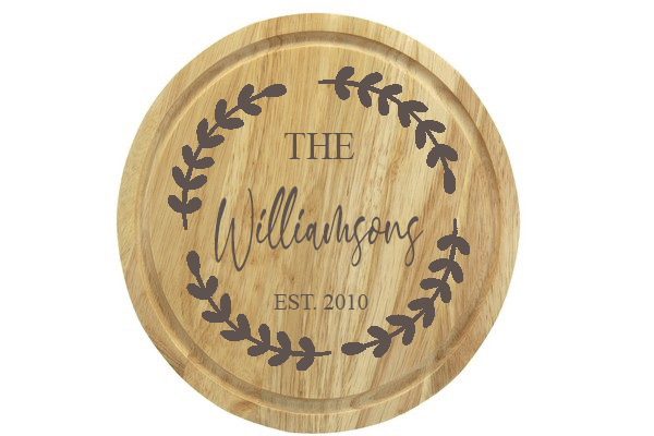Personalised round wooden chopping board. Personalised engraved beer glass. Beautiful engraved personalised gift for every occasion. Personalised gifts for daddy. This image is shown on the personalisation company website. Personalised and affordable gifts for every occassion. Visit www.the-personalisation-company.co.uk