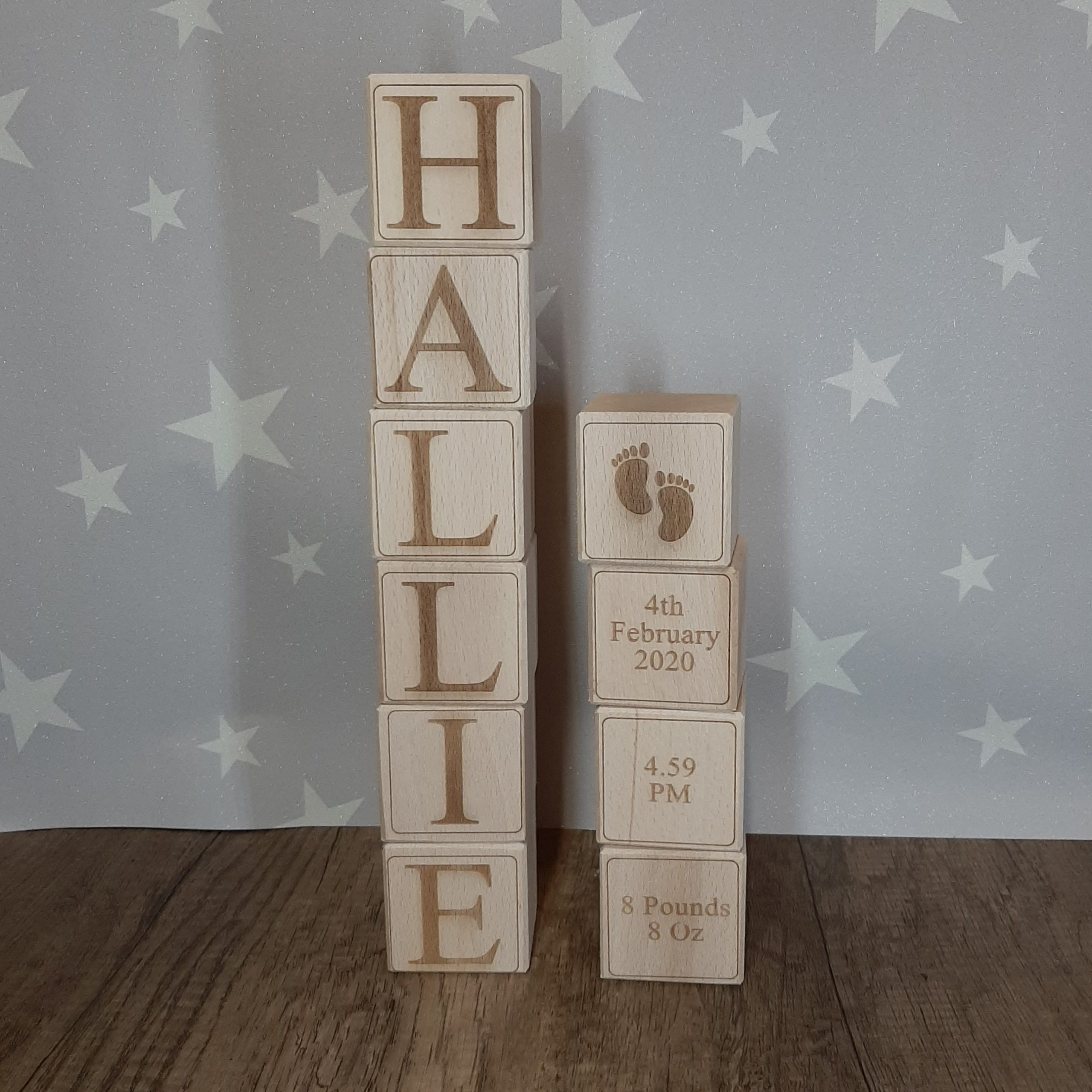 wooden solid baby blocks stacked high showing a name and birth details