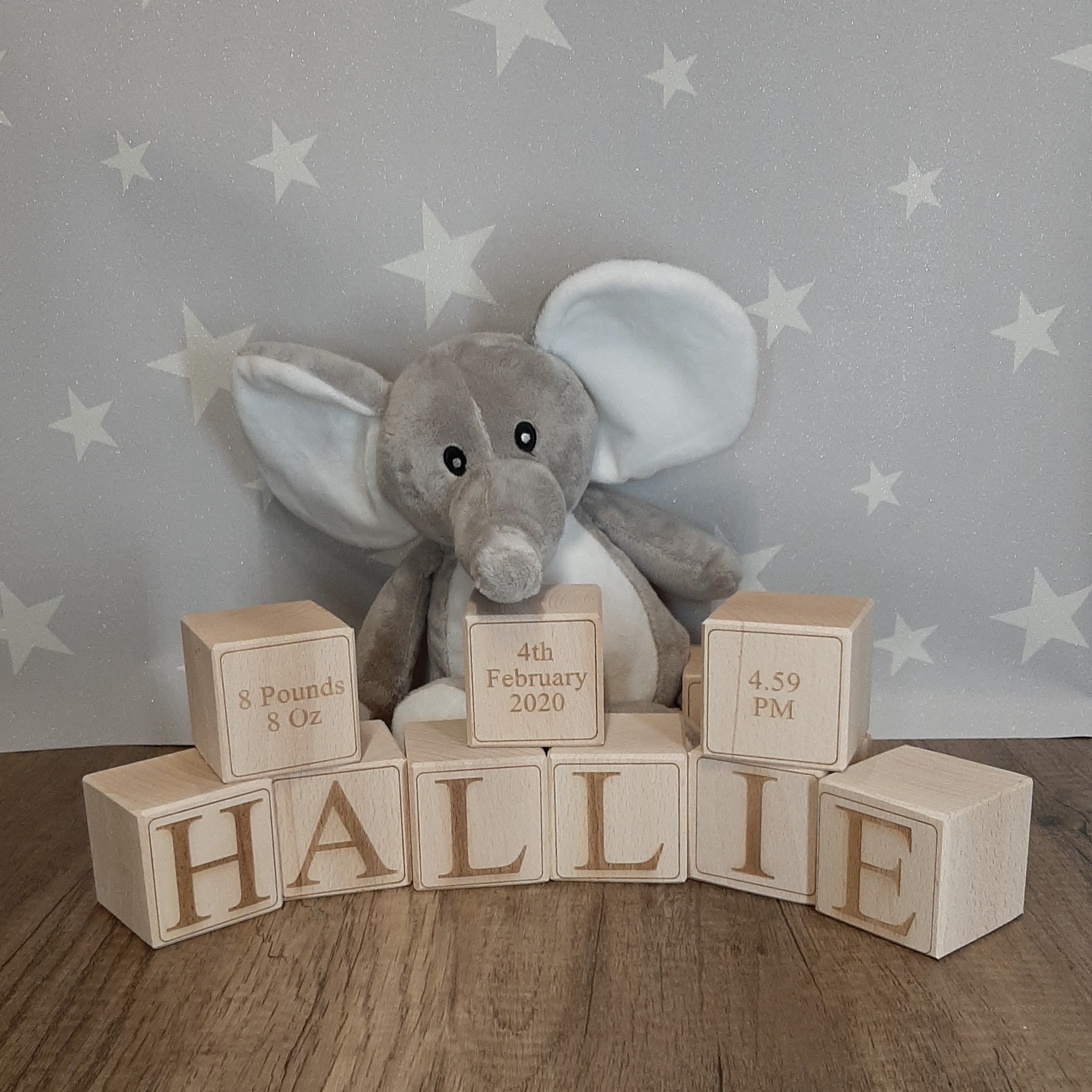 solid wooden personalised baby blocks with star wallpaper in nursery displaying footprints date of birth and weight details wooden solid baby blocks