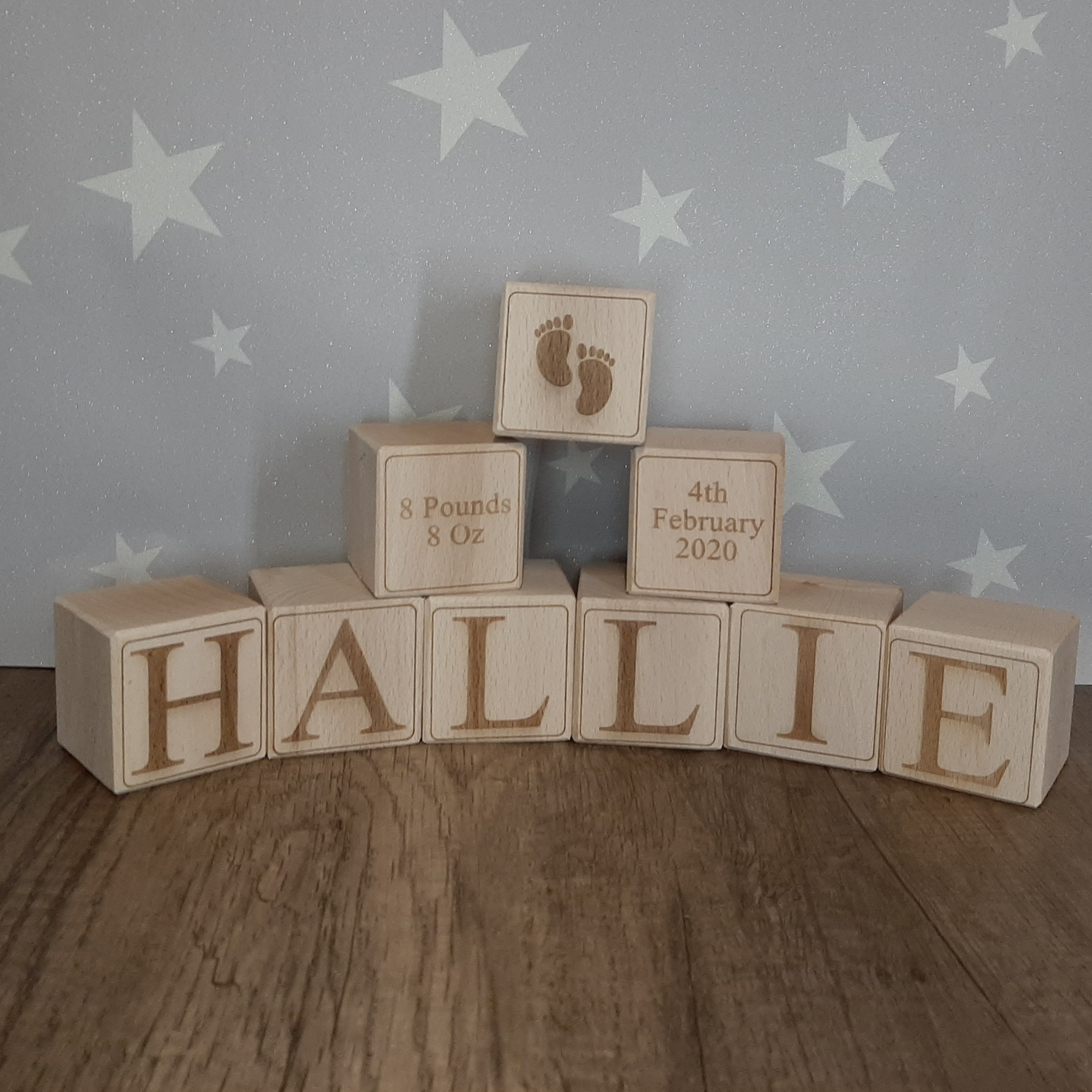 wooden solid baby blocks spelling a name with date of birth