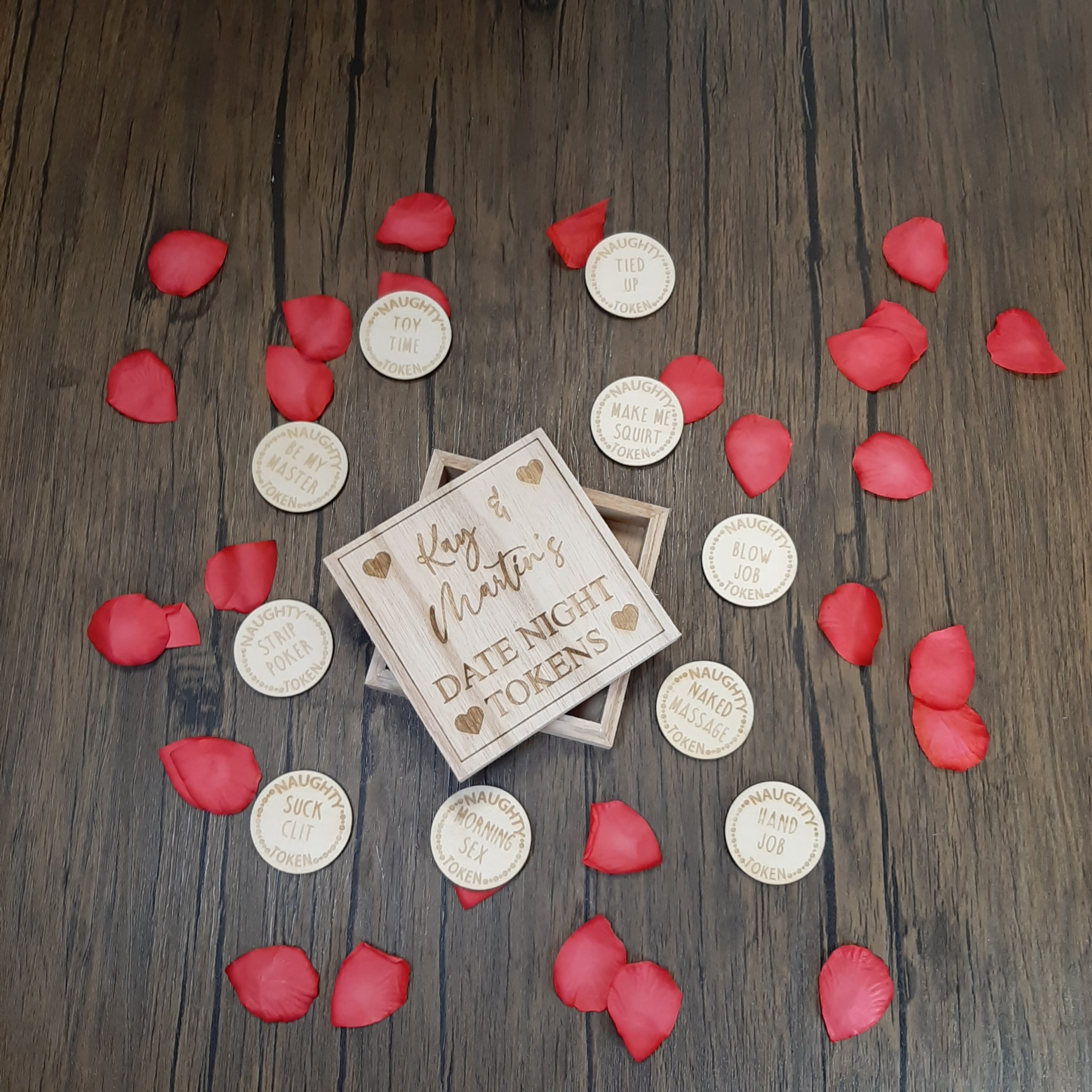 RUDE Date Night Sex Tokens in Box with sex tasks engraved laid on floor with rose petals for valentines day