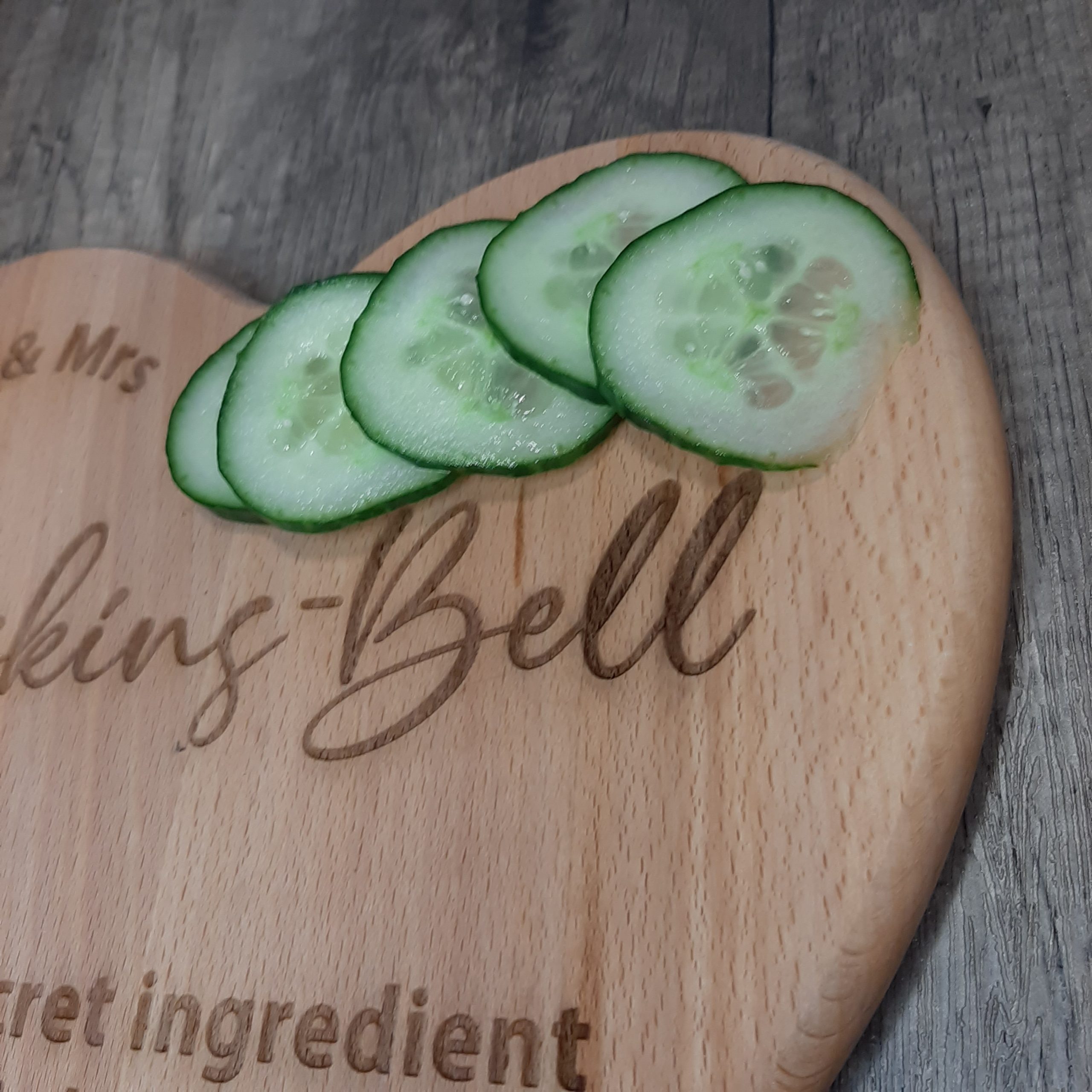 zoomed in on laser engraved heart chopping board personalised ideal wedding gift