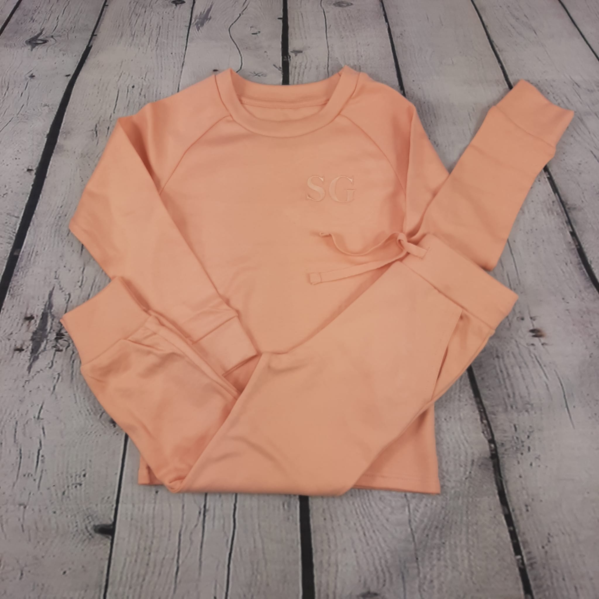 dusky pink childrens loungewear set with matching embroidered initials