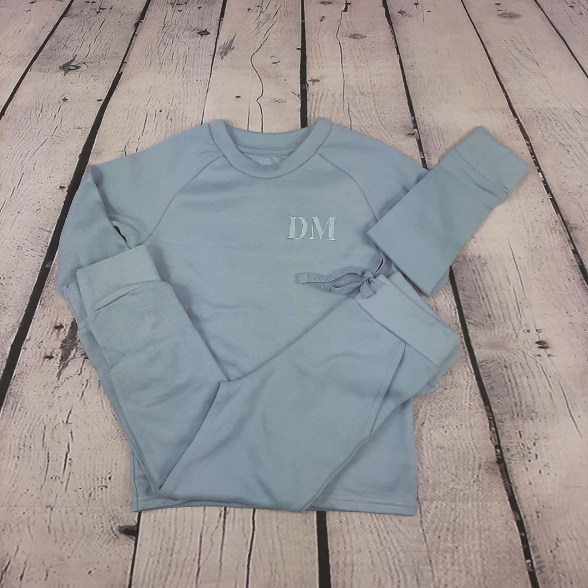 childrens dusky blue loungewear set top and long bottoms with pockets embroidered initials in matching thread