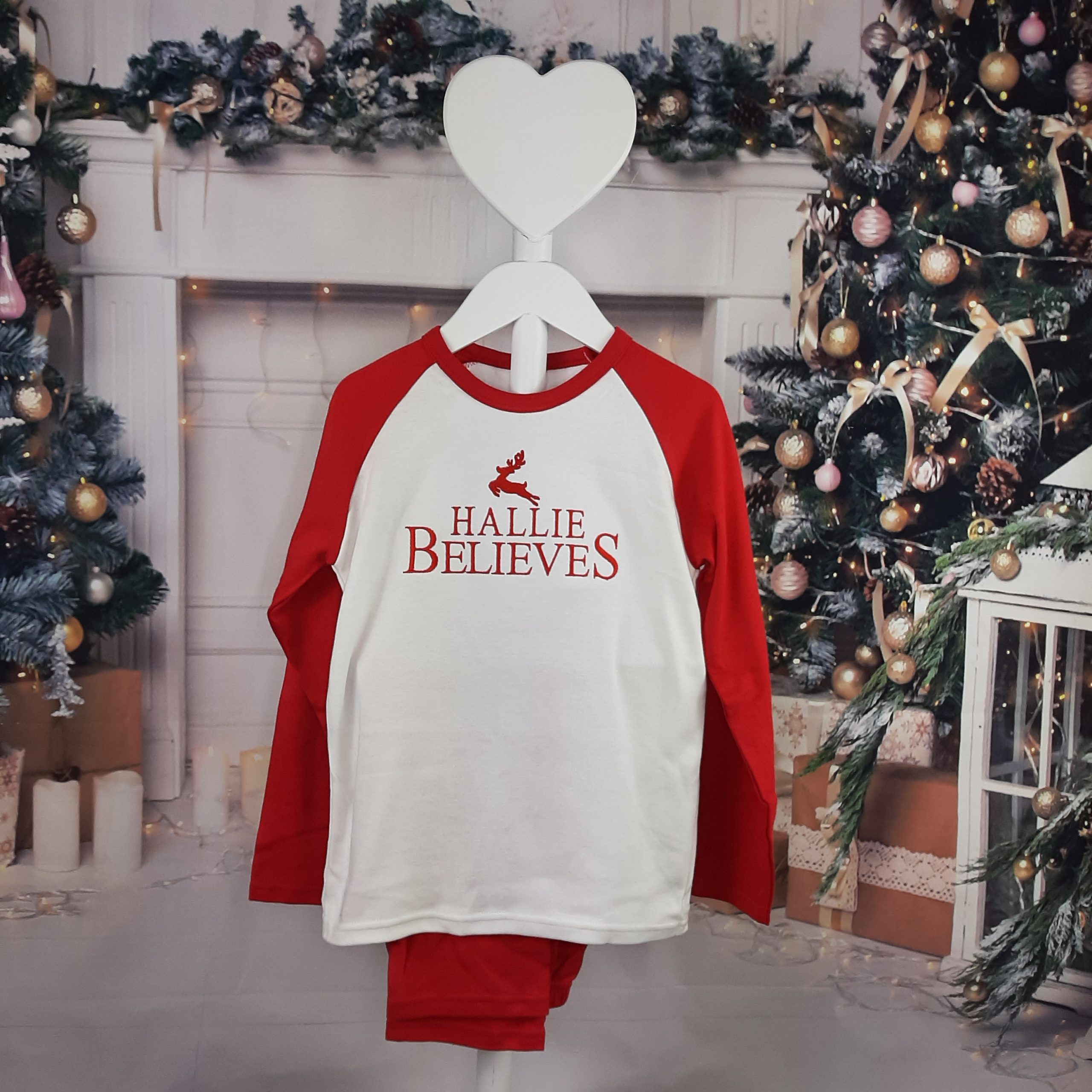 Believes Christmas PJs in red and white for christmas professionally embroidered personalisation. hung
