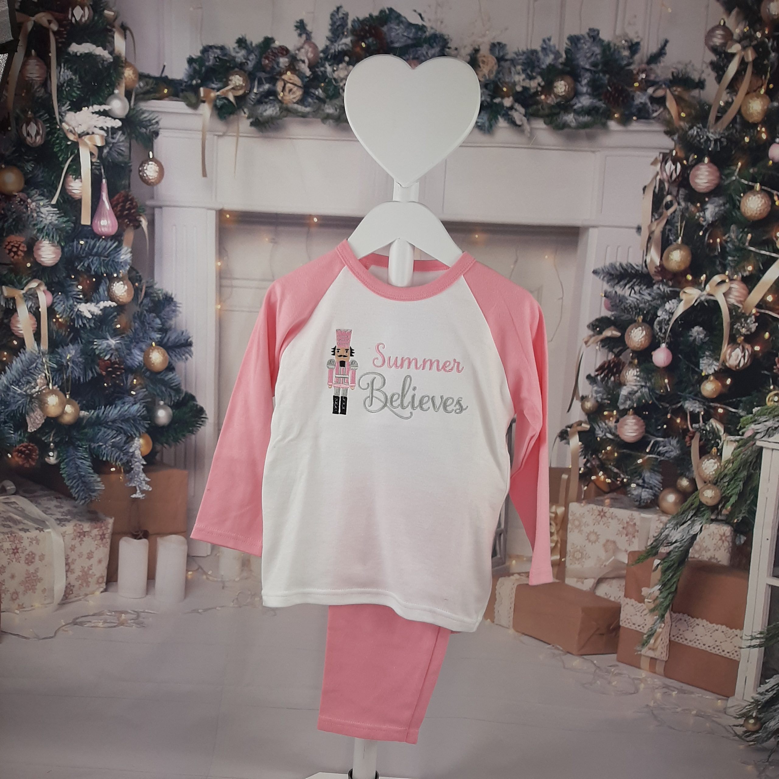 Nutcracker Christmas PJs in pink and white for children with embroidered personalisation. Believes design