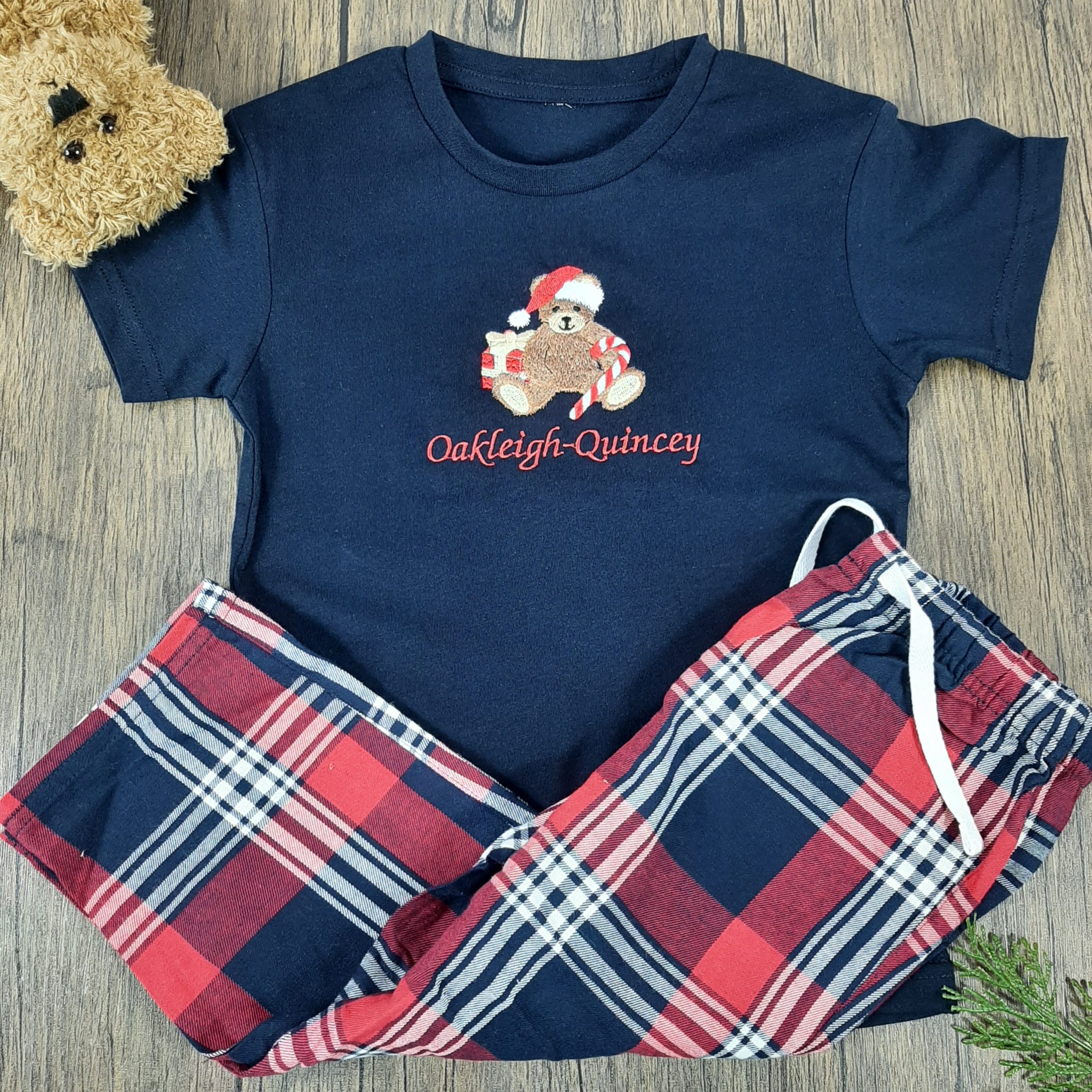 Children's Tartan Teddy PJs are great pyjamas for christmas. All embroidered personalisation. Red name. Laid with teddy