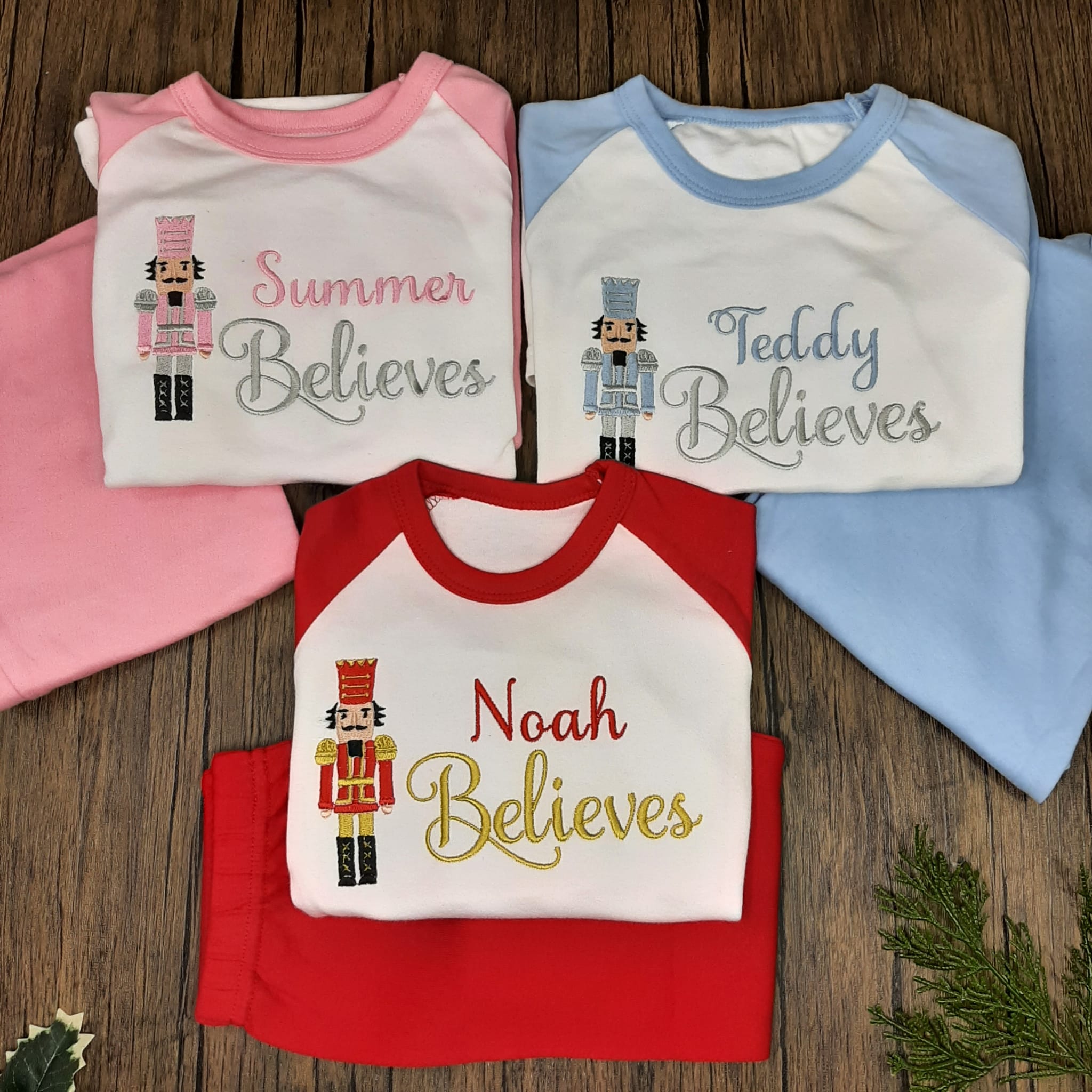 nutcracker christmas pjs in pink blue and red, all personalised with embroidery