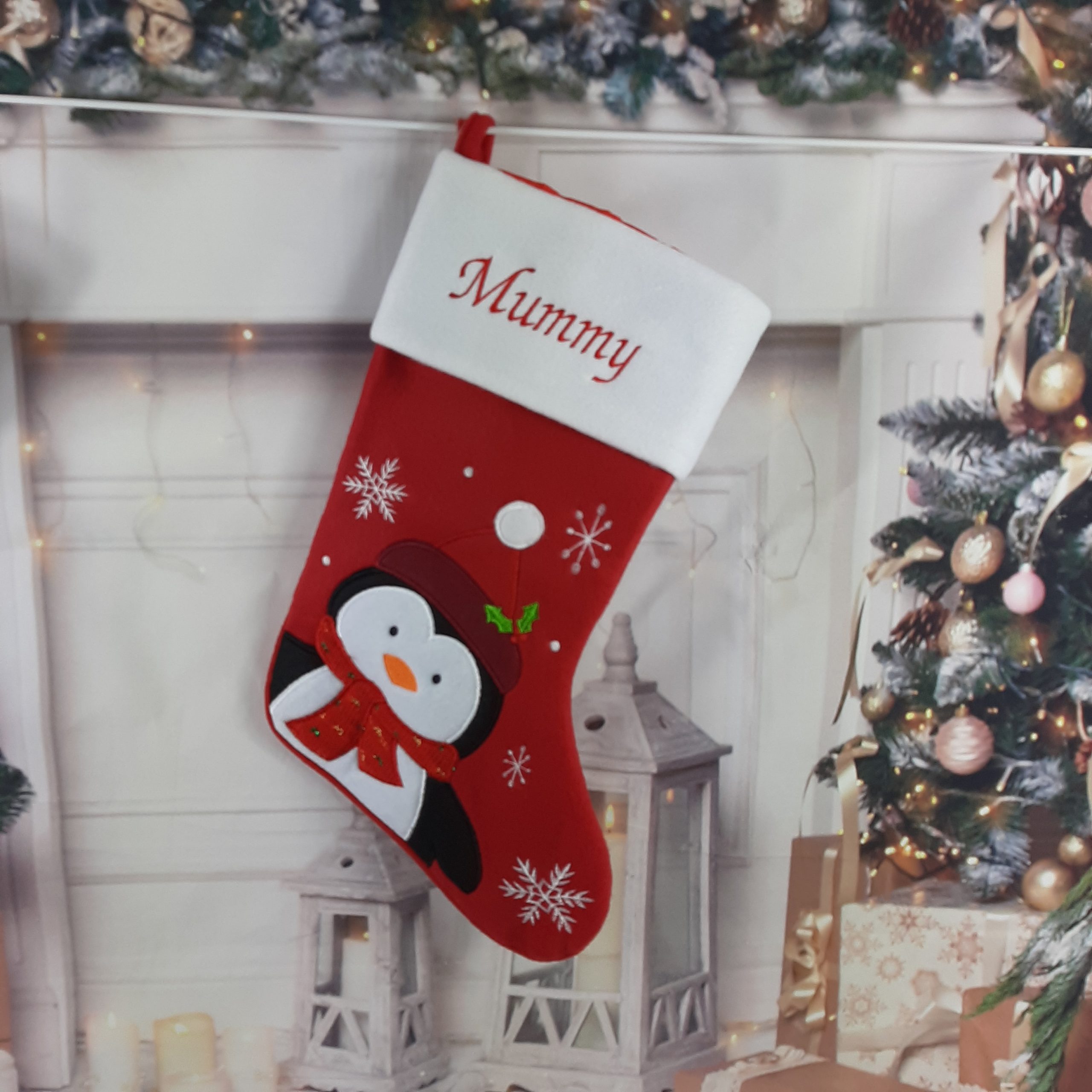 red luxury christmas stocking with embroidered personalised name with penguin