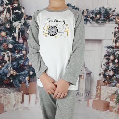 New Years Eve Sparkly Pjs embroidered personalisation with glitter modelled by a boy but suitable for a girl