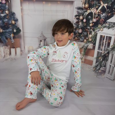 Winter Wonderland Christmas Pyjamas for Kids - Personalised with embroidery, great bargain cheap first christmas pyamas. boy and girl sitting down