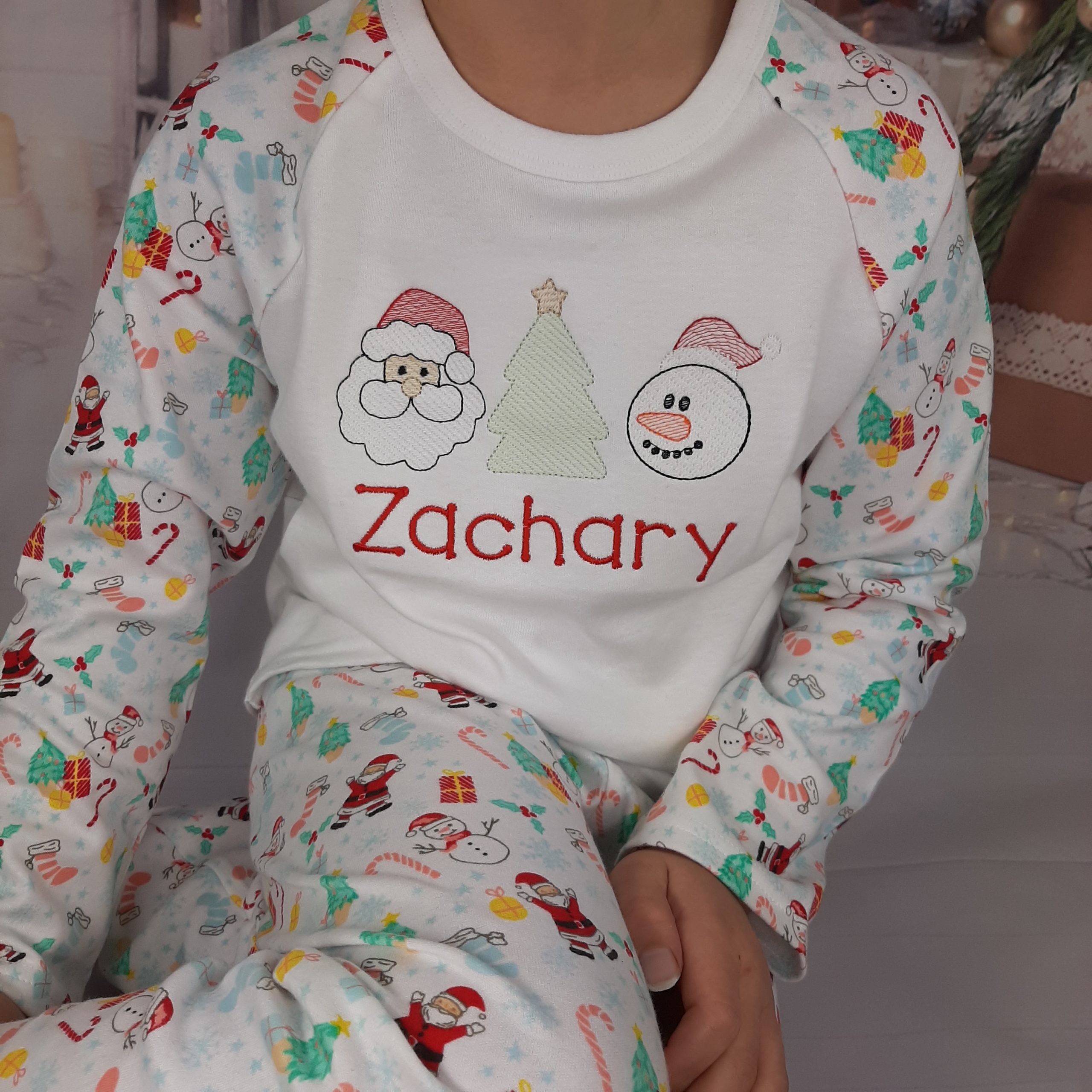 Winter Wonderland Christmas Pyjamas for Kids - Personalised with embroidery, great bargain cheap first christmas pyamas. close up of the embroidery name