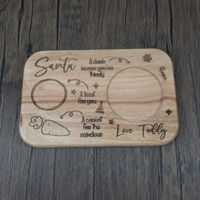 Wooden personalised santa treat board with custom engraved design with name.