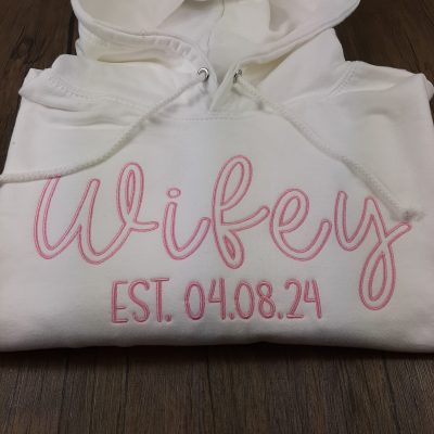 wifey hubby hoodie with embroidered design with est. date. great valentines day or anniversary gift folded gift for her gift for him close up
