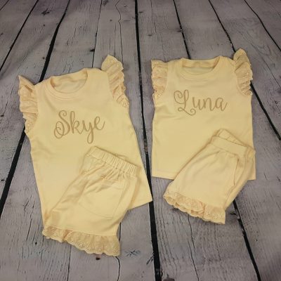 children's frill shorts and t shirt set with embroidered personalisation in apricot cream